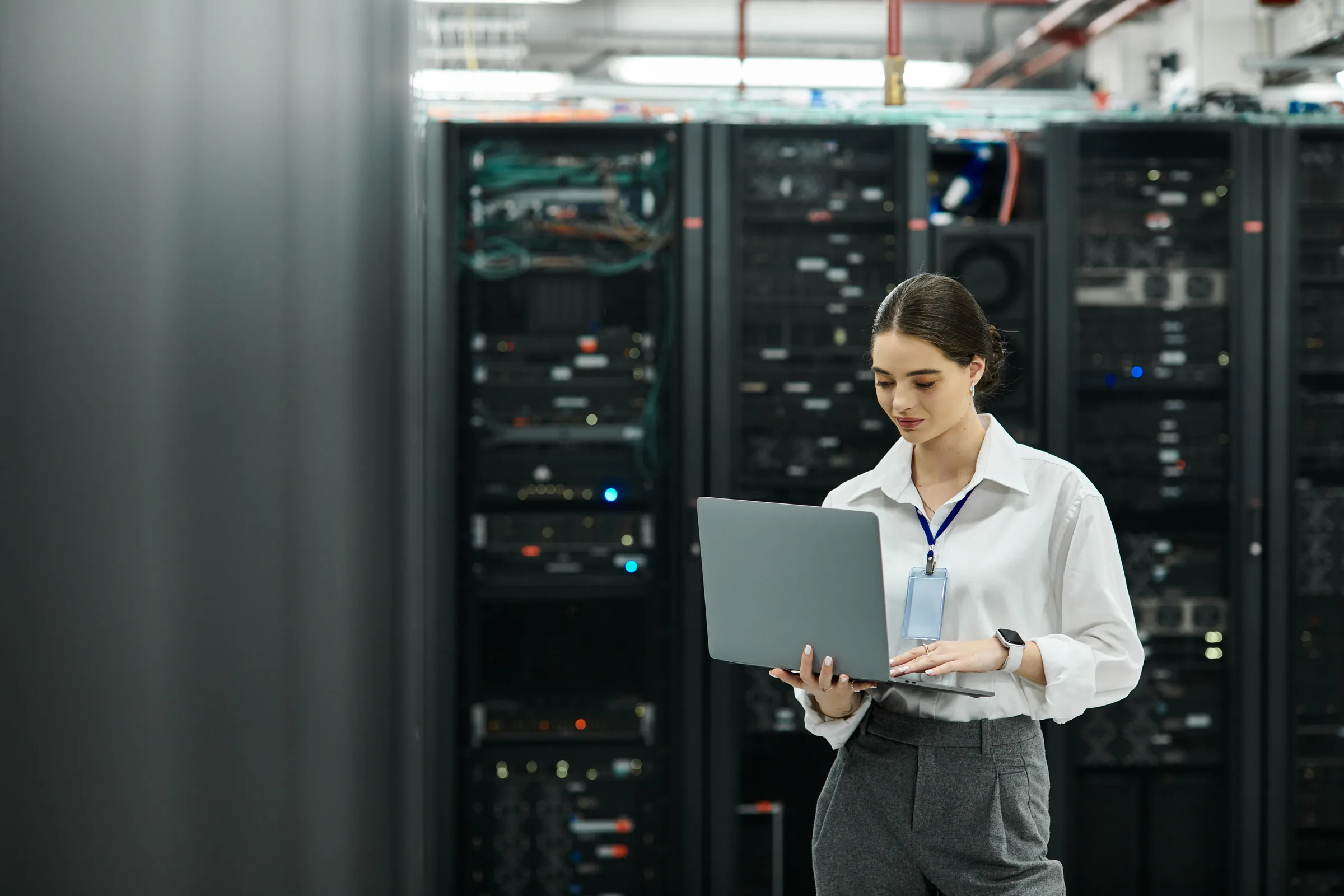 Technician managing network systems in a modern data center — colocation and operator equipment financing