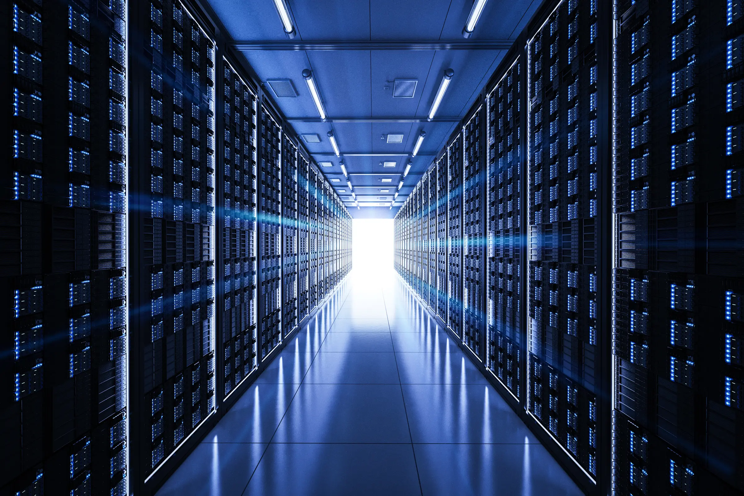 Rows of server racks in a data center aisle — data center equipment financing