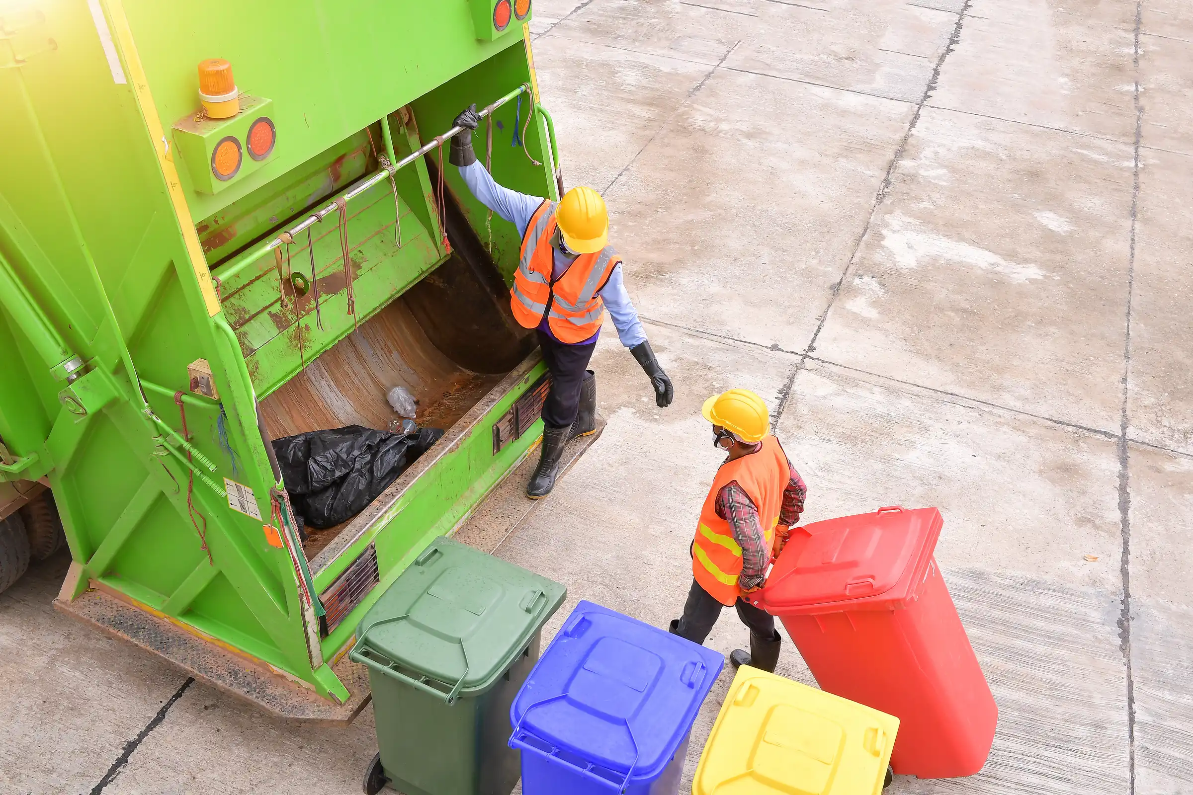 Refuse collection truck on a municipal route — waste management equipment financing